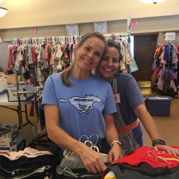 First Congo volunteers smiling at the Rummage Sale