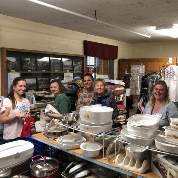 First Congo volunteers smiling at the Rummage Sale