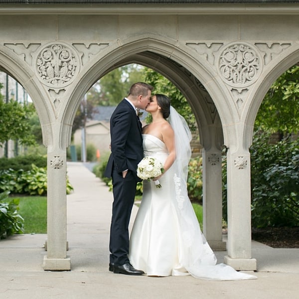 A couple getting married at First Congo church under the archway