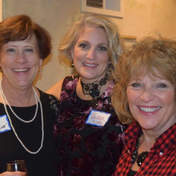 Becy, Susan and a friend smile for the camera at an event
