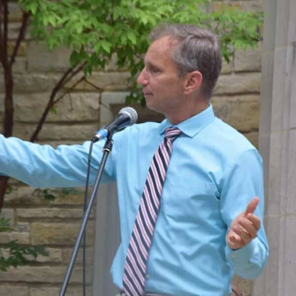 Pastor Rich speaking outside of church doors