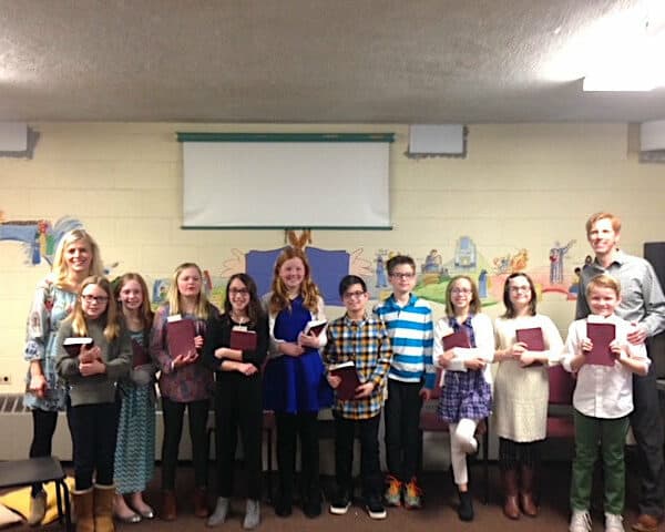 Sunday School kids holding bibles