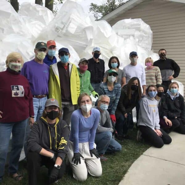 First Congo Green Team standing in front of large piles of styrofoam